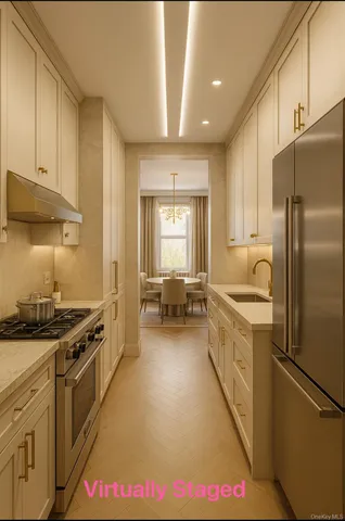 a large kitchen with stainless steel appliances granite countertop a stove a sink and a refrigerator