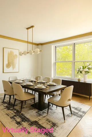a view of a dining room with furniture and window