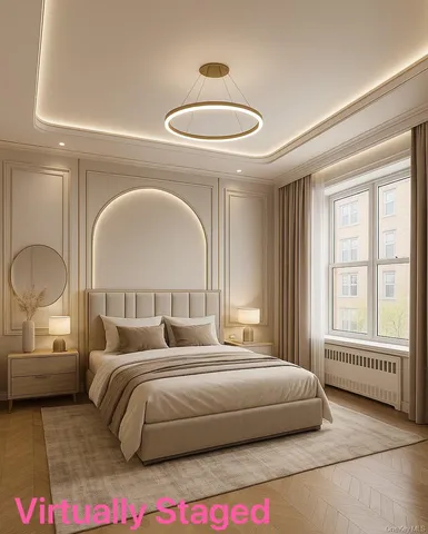 a bedroom with a bed and a large mirror