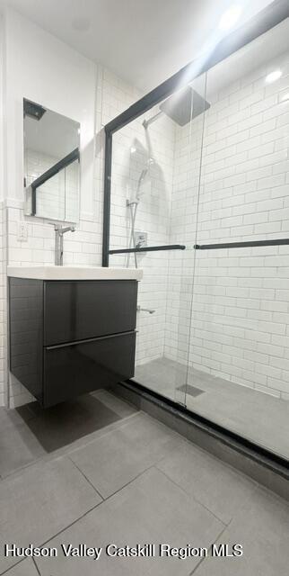473 Main Street, Unit 1 Catskill, NY 12414 - Photo 4 of 8 a bathroom with a sink and mirror
