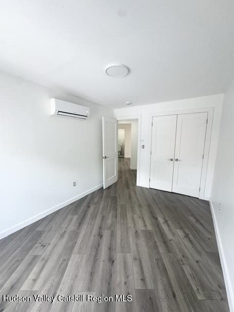 473 Main Street, Unit 1 Catskill, NY 12414 - Photo 6 of 8 wooden floor in an empty room