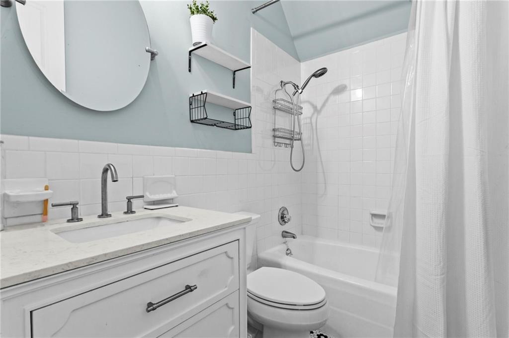 2630 Old Atlanta Road Cumming, GA 30041 - Photo 69 of 87 a bathroom with a sink a toilet and a mirror