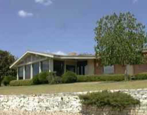 1116 Challenger Austin, TX 78734 - Photo 1 of 1 a front view of a house with a yard