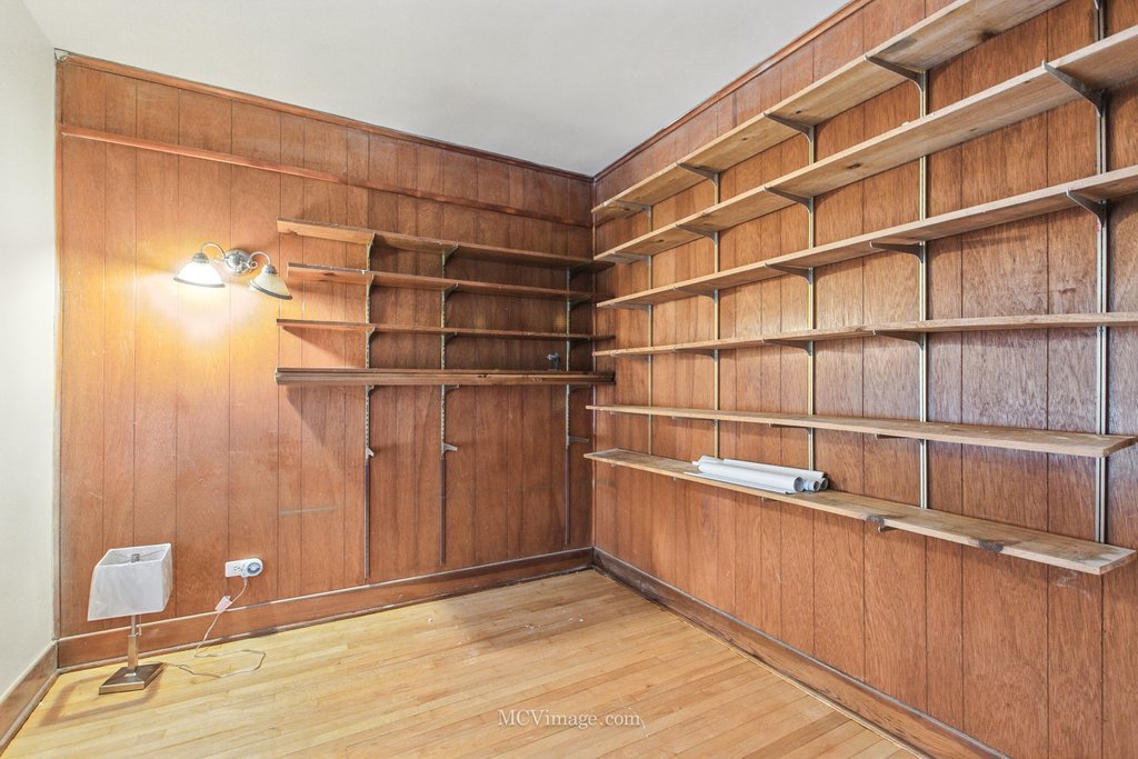 10130 South Lowe Avenue Chicago, IL 60628 - Photo 18 of 23 a view of walk in closet with empty racks