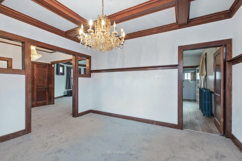 10130 South Lowe Avenue Chicago, IL 60628 - Photo 9 of 23 a view of a livingroom with a chandelier