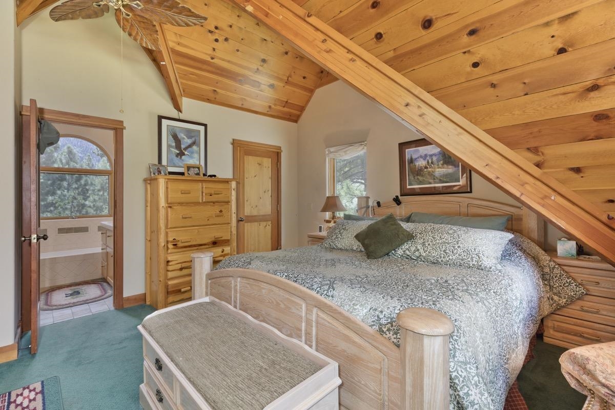 11650 Twin Lakes Road Bridgeport, CA 93517 - Photo 20 of 39 Bedroom featuring carpet, wood ceiling, and multiple windows