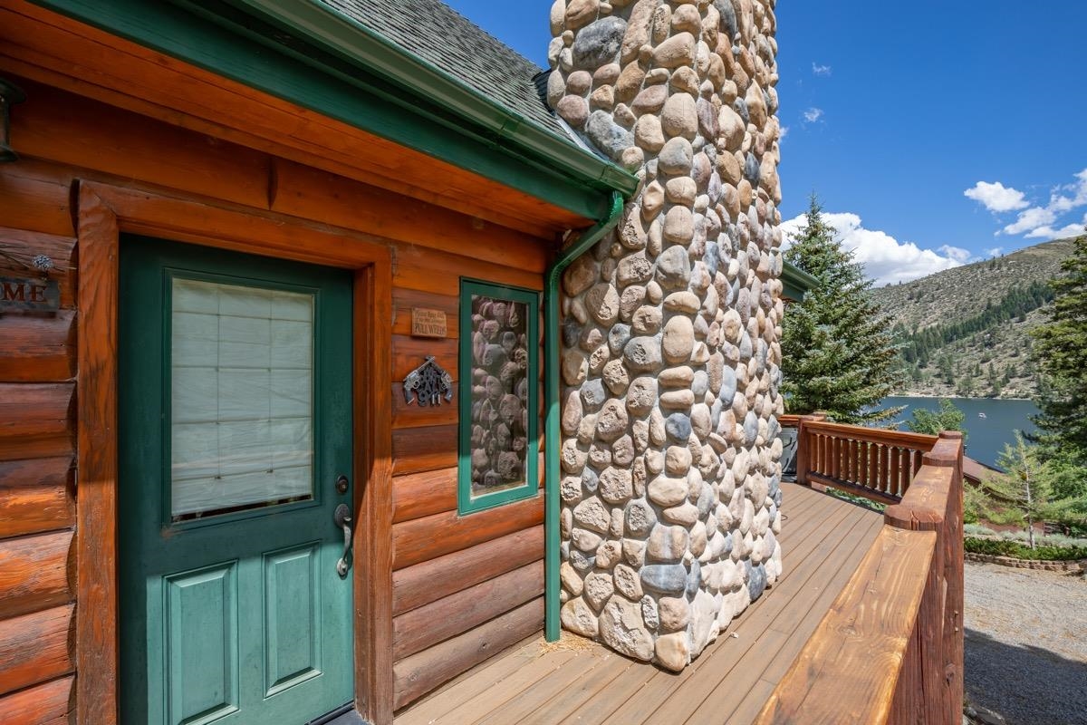 Doorway to property featuring a water view