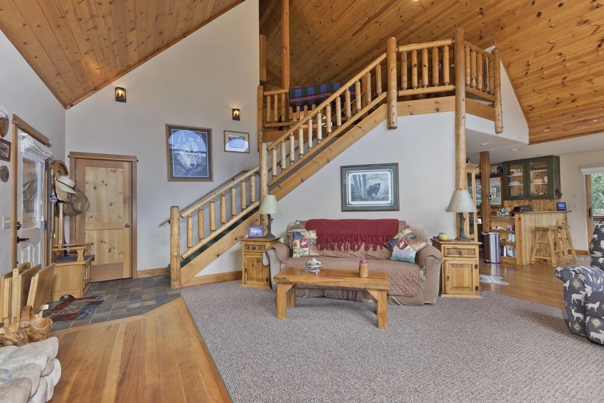 11650 Twin Lakes Road Bridgeport, CA 93517 - Photo 8 of 39 Living area featuring wood ceiling, high vaulted ceiling, wood finished floors, and stairs