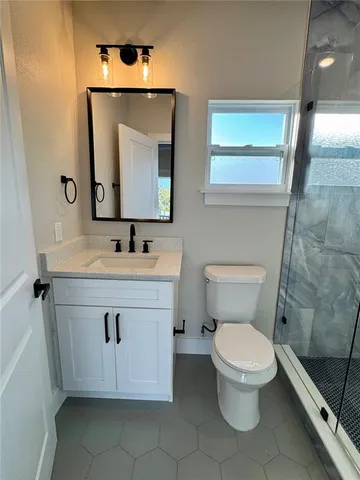 a kitchen with stainless steel appliances granite countertop a refrigerator a stove top oven a sink and dishwasher