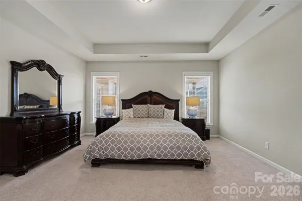 a bedroom with a bed and a closet