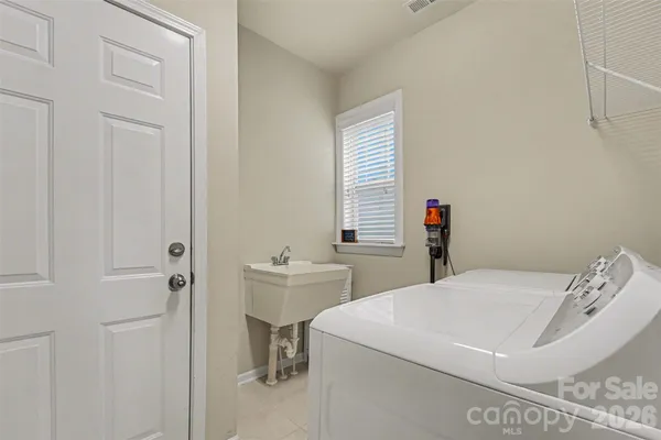 a bedroom with a bed and a table in it