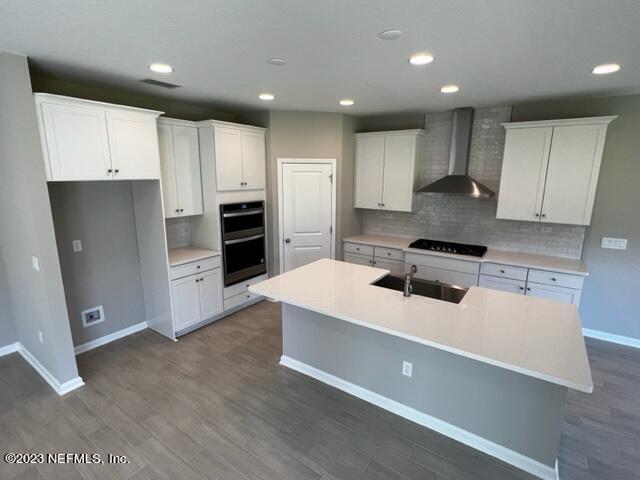 47 Goldcrest Way St. Augustine, FL 32092 - Photo 5 of 10 a large white kitchen with stainless steel appliances