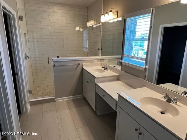 47 Goldcrest Way St. Augustine, FL 32092 - Photo 8 of 10 a bathroom with a sink double vanity granite and a mirror