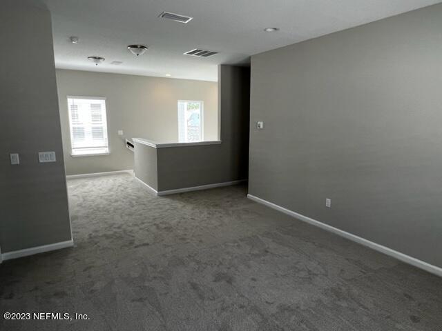 47 Goldcrest Way St. Augustine, FL 32092 - Photo 9 of 10 an empty room with windows