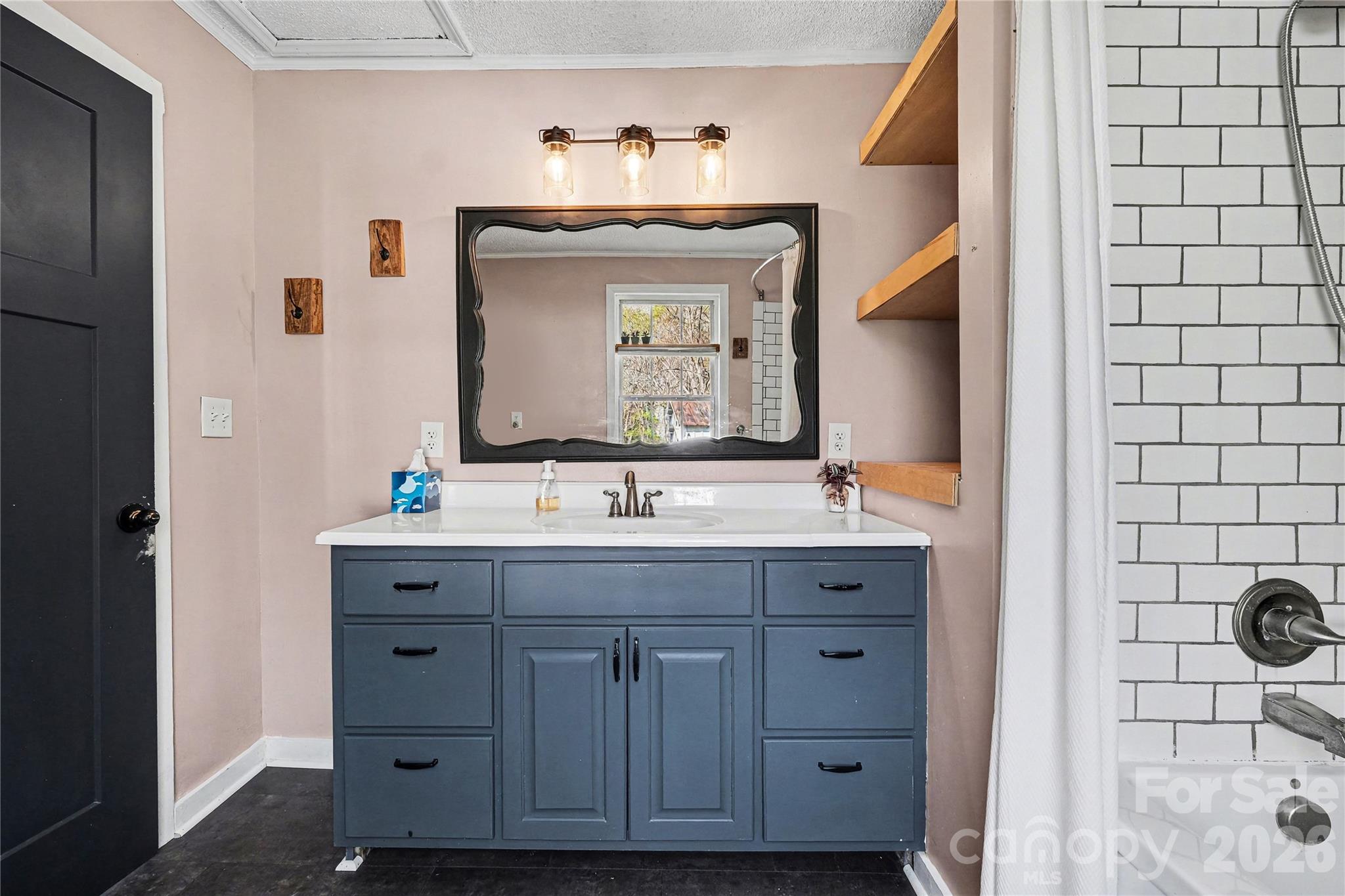 1175 Old Salisbury-Concord Road Concord, NC 28025 - Photo 13 of 31 a bathroom with a granite countertop sink vanity and mirror