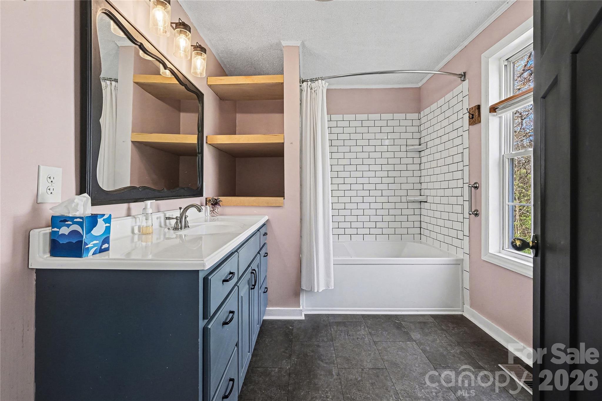 1175 Old Salisbury-Concord Road Concord, NC 28025 - Photo 16 of 31 a bathroom with a sink a vanity and a mirror