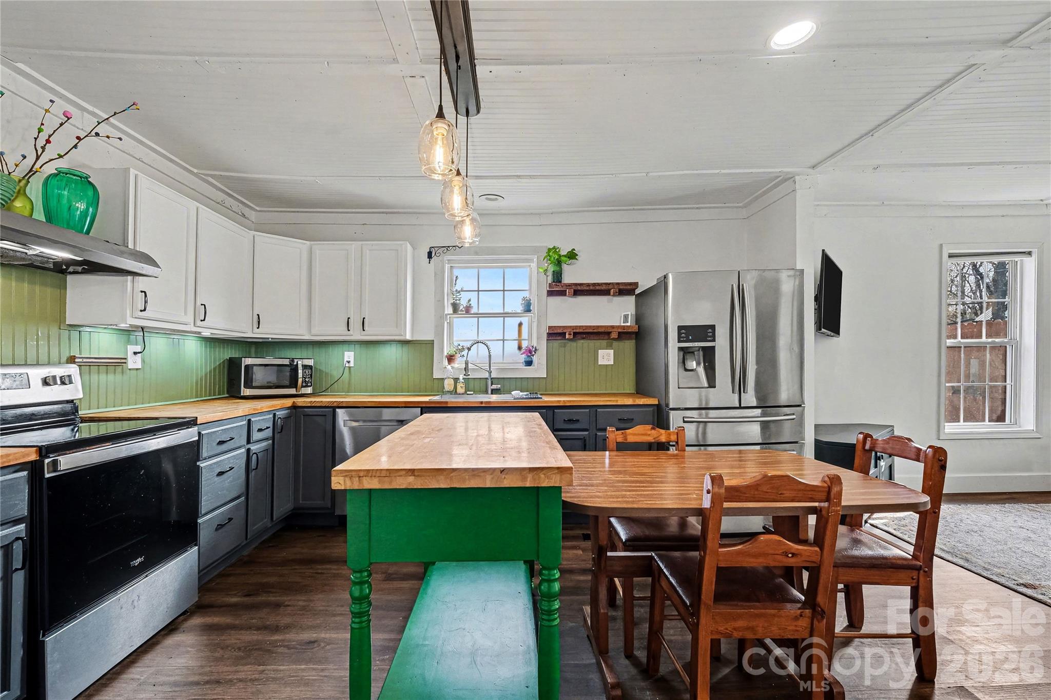 1175 Old Salisbury-Concord Road Concord, NC 28025 - Photo 18 of 31 a kitchen with kitchen island a table and chairs in it