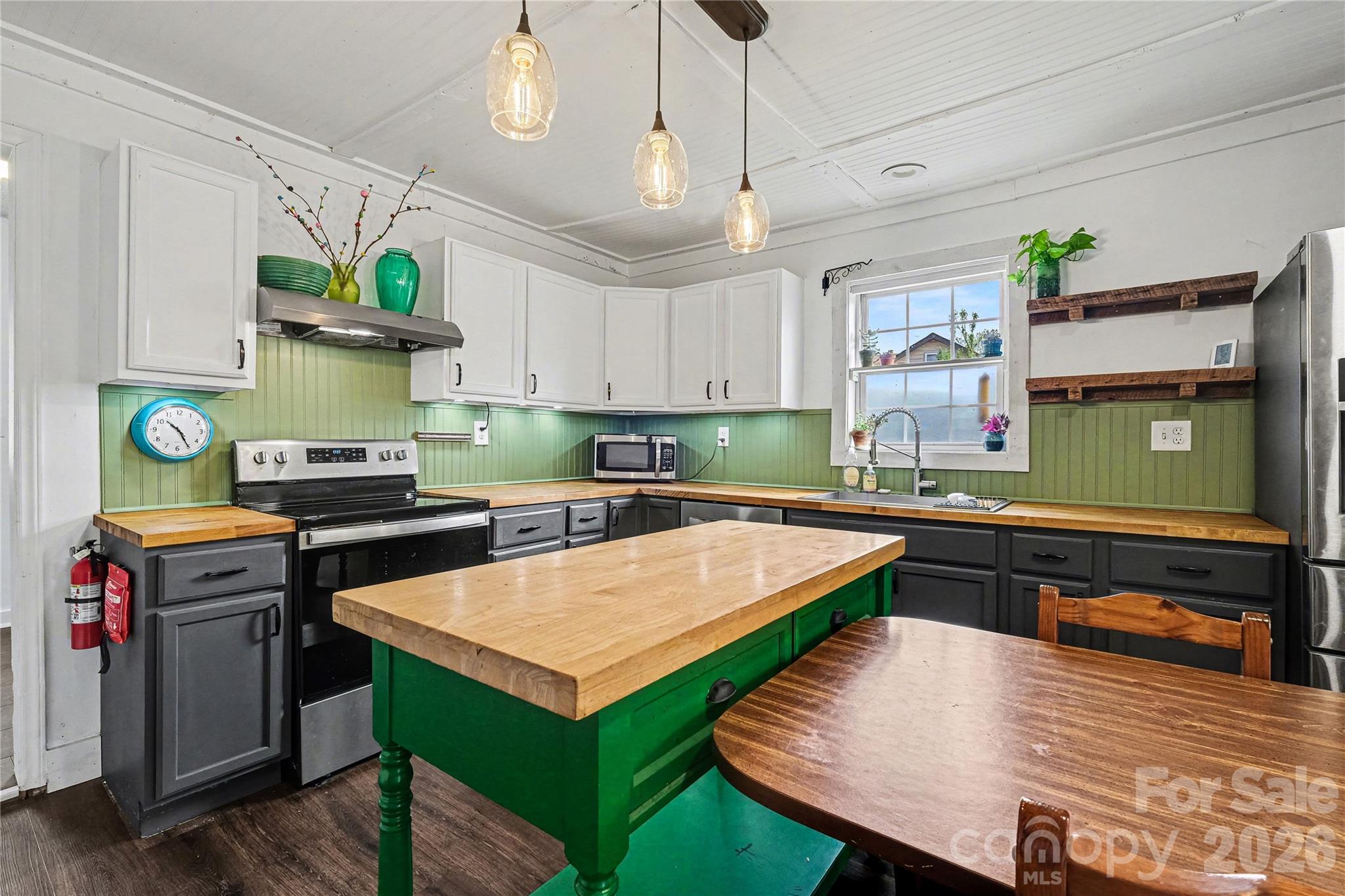 1175 Old Salisbury-Concord Road Concord, NC 28025 - Photo 21 of 31 a kitchen with stainless steel appliances granite countertop a stove top oven a sink a counter space and cabinets