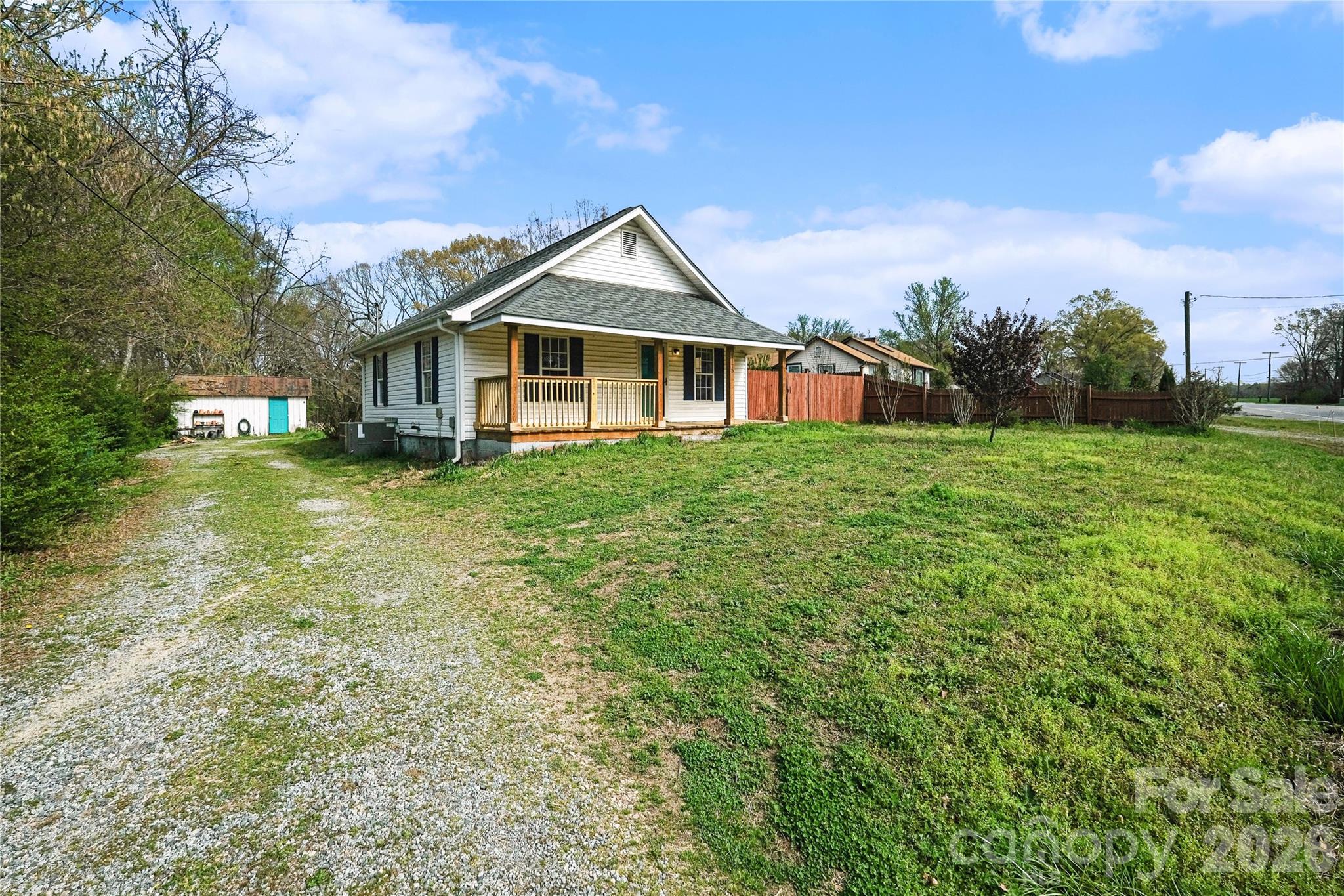 1175 Old Salisbury-Concord Road Concord, NC 28025 - Photo 3 of 31 a front view of a house with a garden