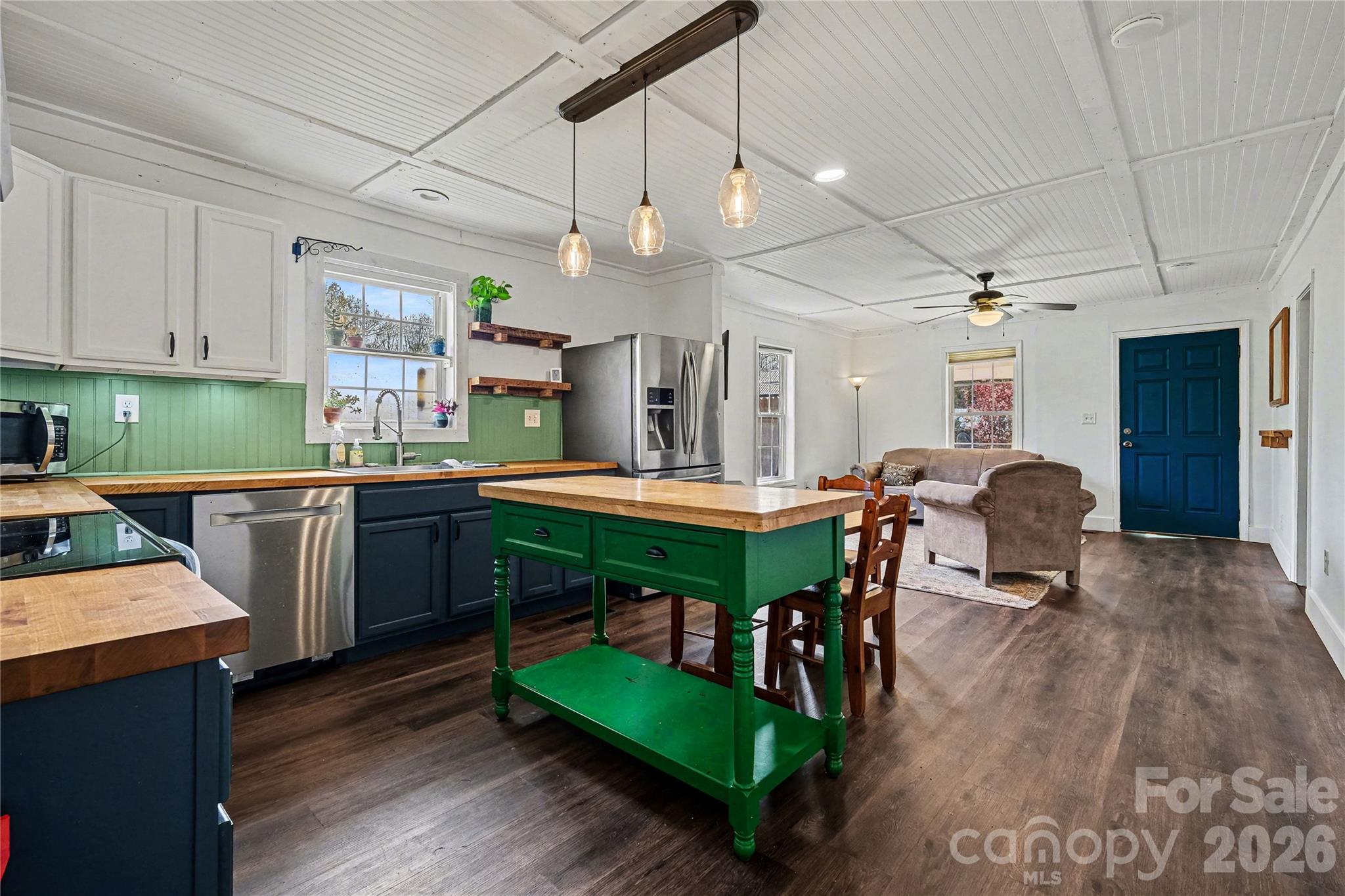 1175 Old Salisbury-Concord Road Concord, NC 28025 - Photo 8 of 31 a kitchen with a table chairs refrigerator and cabinets