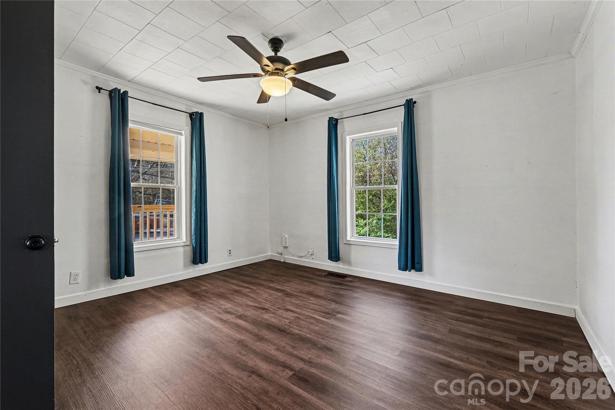 1175 Old Salisbury-Concord Road Concord, NC 28025 - Photo 9 of 31 a view of an empty room with wooden floor and a window