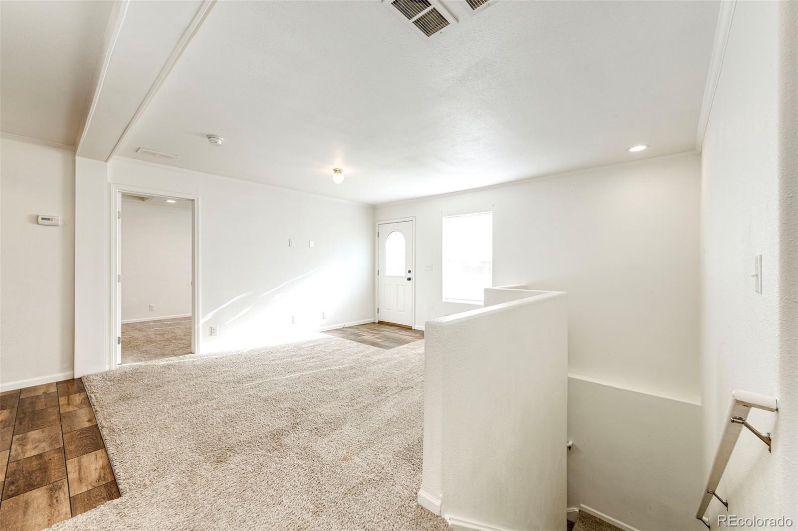 574 4th Street Bennett, CO 80102 - Photo 11 of 24 a view of an empty room