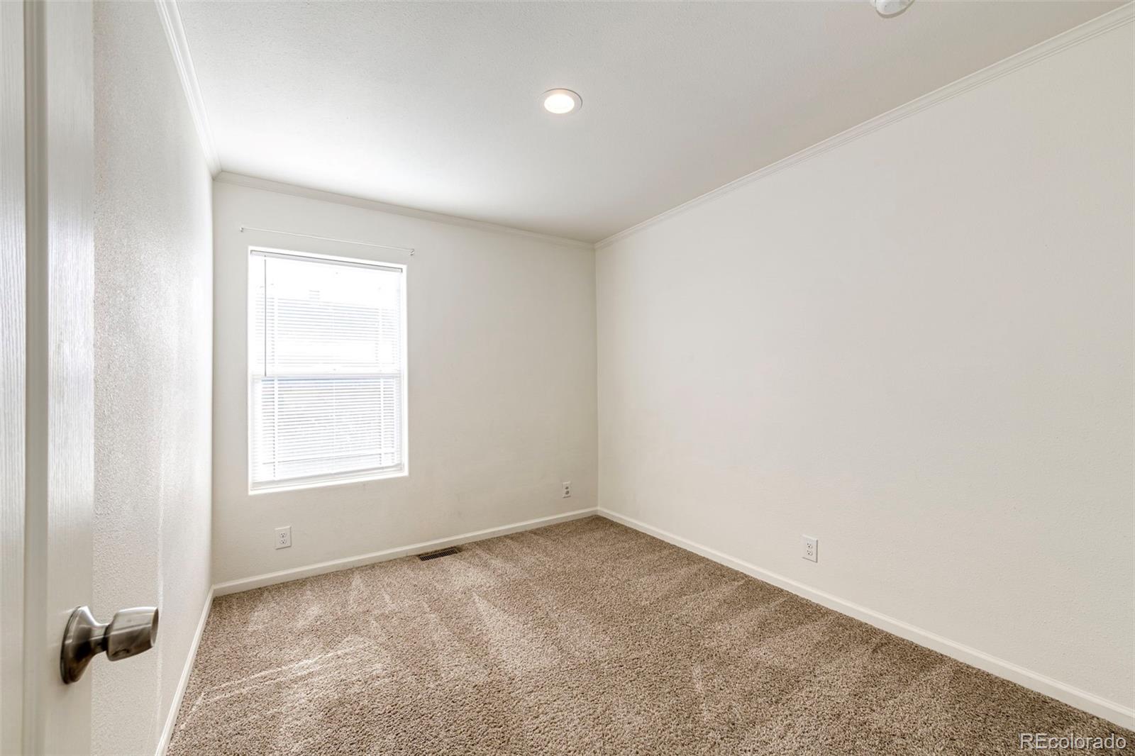 574 4th Street Bennett, CO 80102 - Photo 12 of 24 an empty room with a window