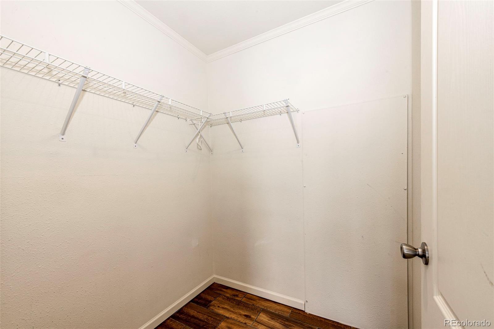 574 4th Street Bennett, CO 80102 - Photo 16 of 24 a view of a room with racks on the wall