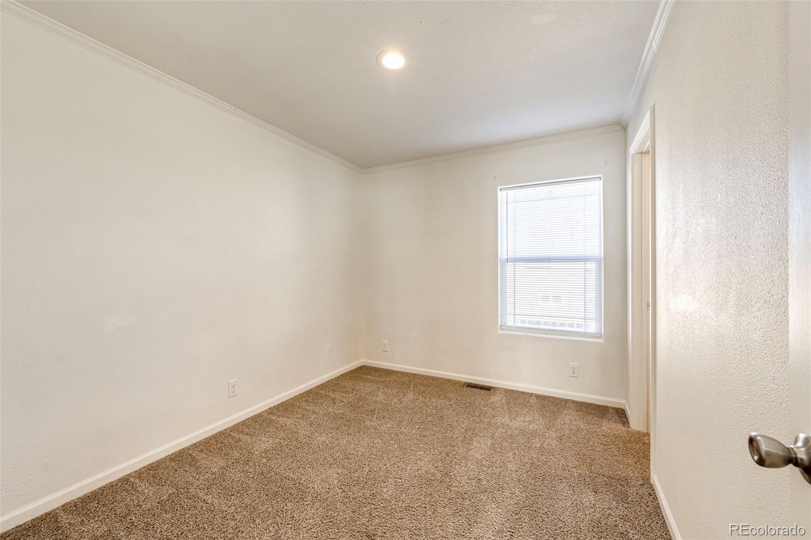 574 4th Street Bennett, CO 80102 - Photo 18 of 24 an empty room with a window