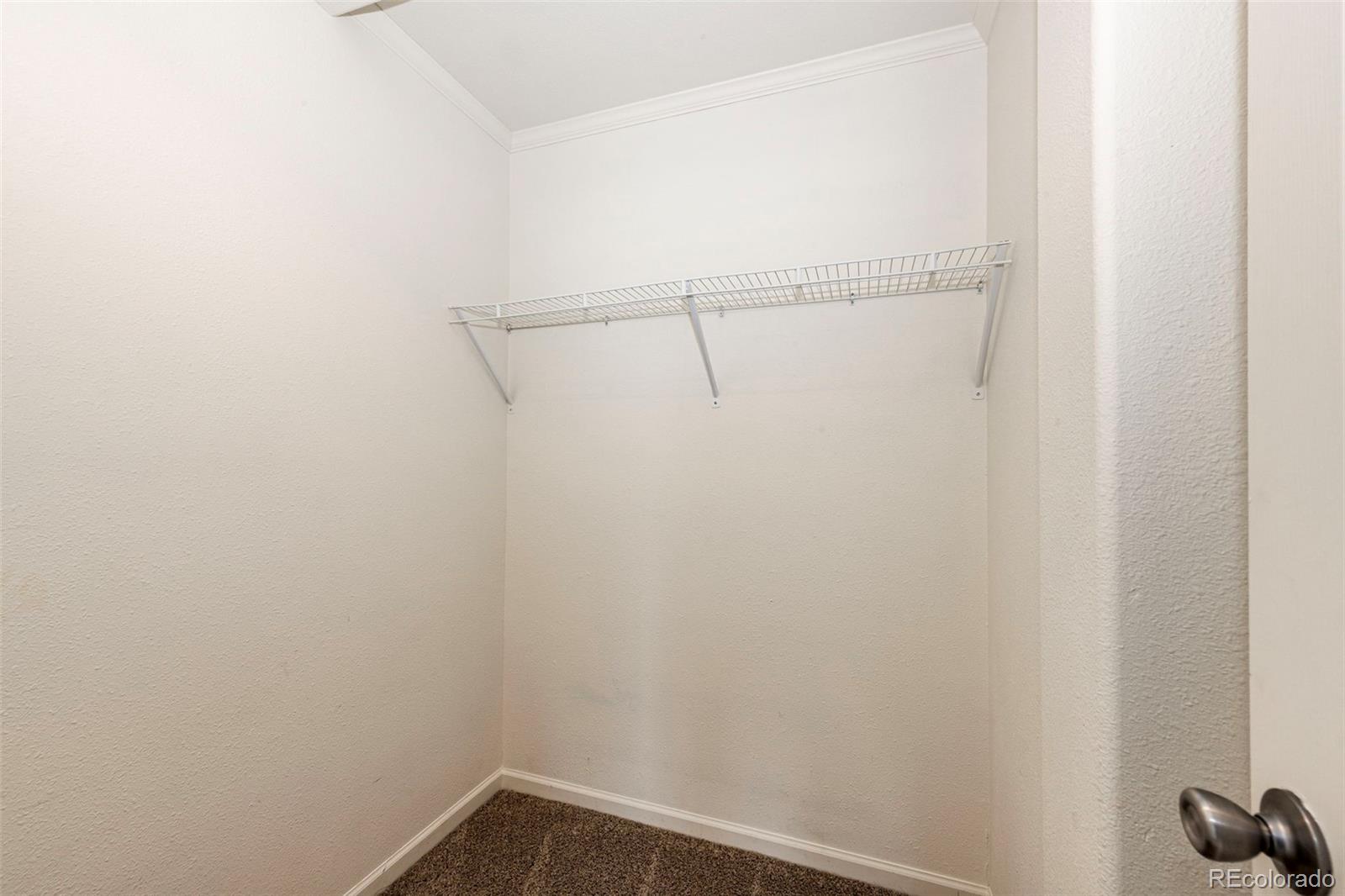 574 4th Street Bennett, CO 80102 - Photo 23 of 24 a view of small space with racks on the wall