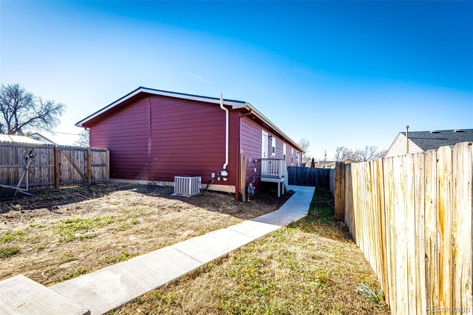 574 4th Street Bennett, CO 80102 - Photo 4 of 24 a view of a house with a yard