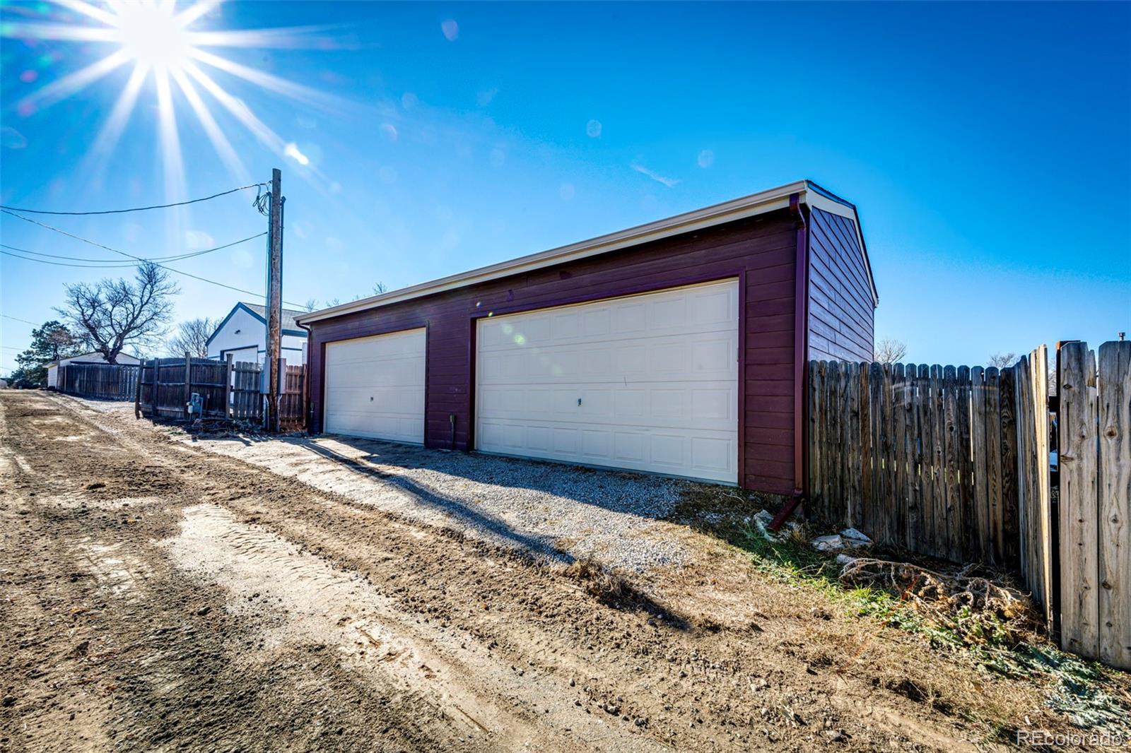 574 4th Street Bennett, CO 80102 - Photo 6 of 24 a wooden door with a outdoor space