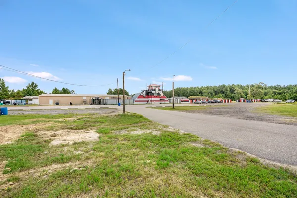 an aerial view of residential house with outdoor space and lake view