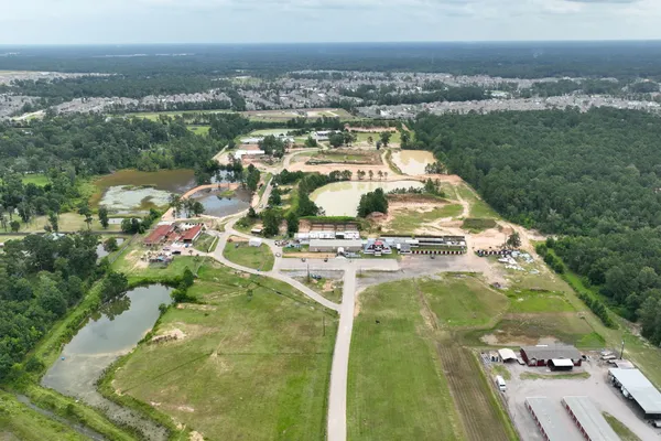 an aerial view of a house with yard lake and lake view