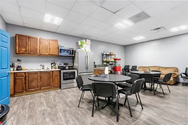 a workspace with furniture and wooden floor