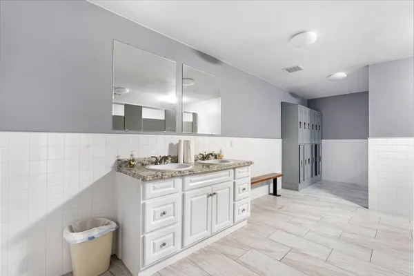 a front view of a house with a yard and a garage