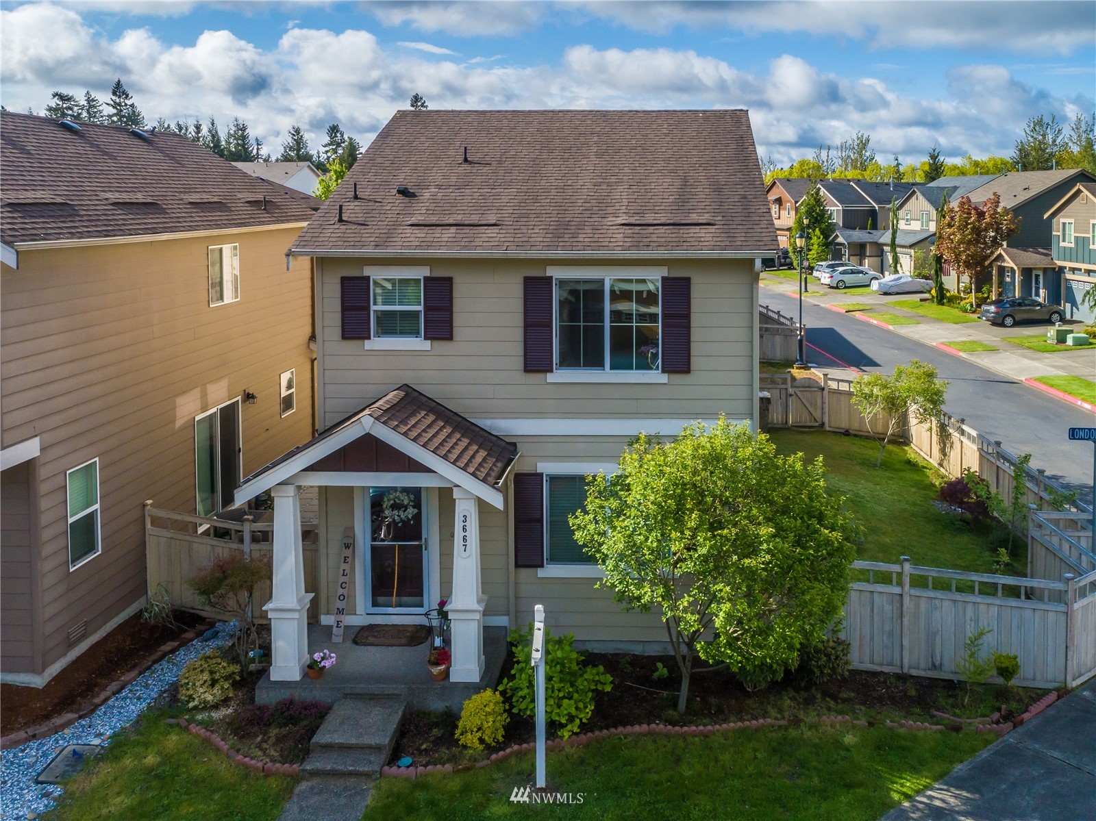 3667 London Loop Northeast Lacey, WA 98516 - Photo 1 of 26 a front view of a house with garden