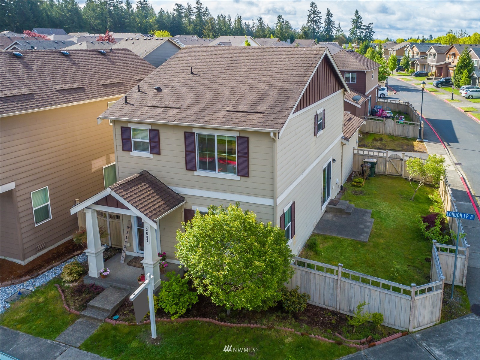 3667 London Loop Northeast Lacey, WA 98516 - Photo 21 of 26 an aerial view of a house with garden space and street view