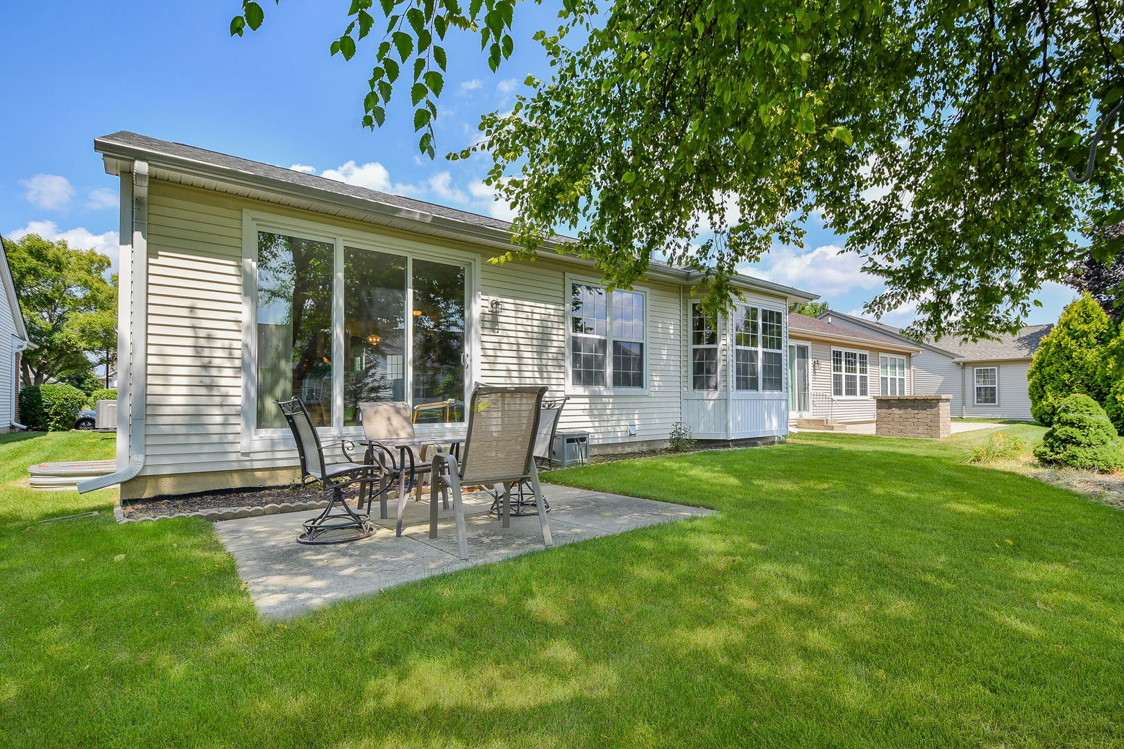 2525 Rolling Ridge Elgin, IL 60124 - Photo 19 of 26 a view of a chair and table in backyard of the house