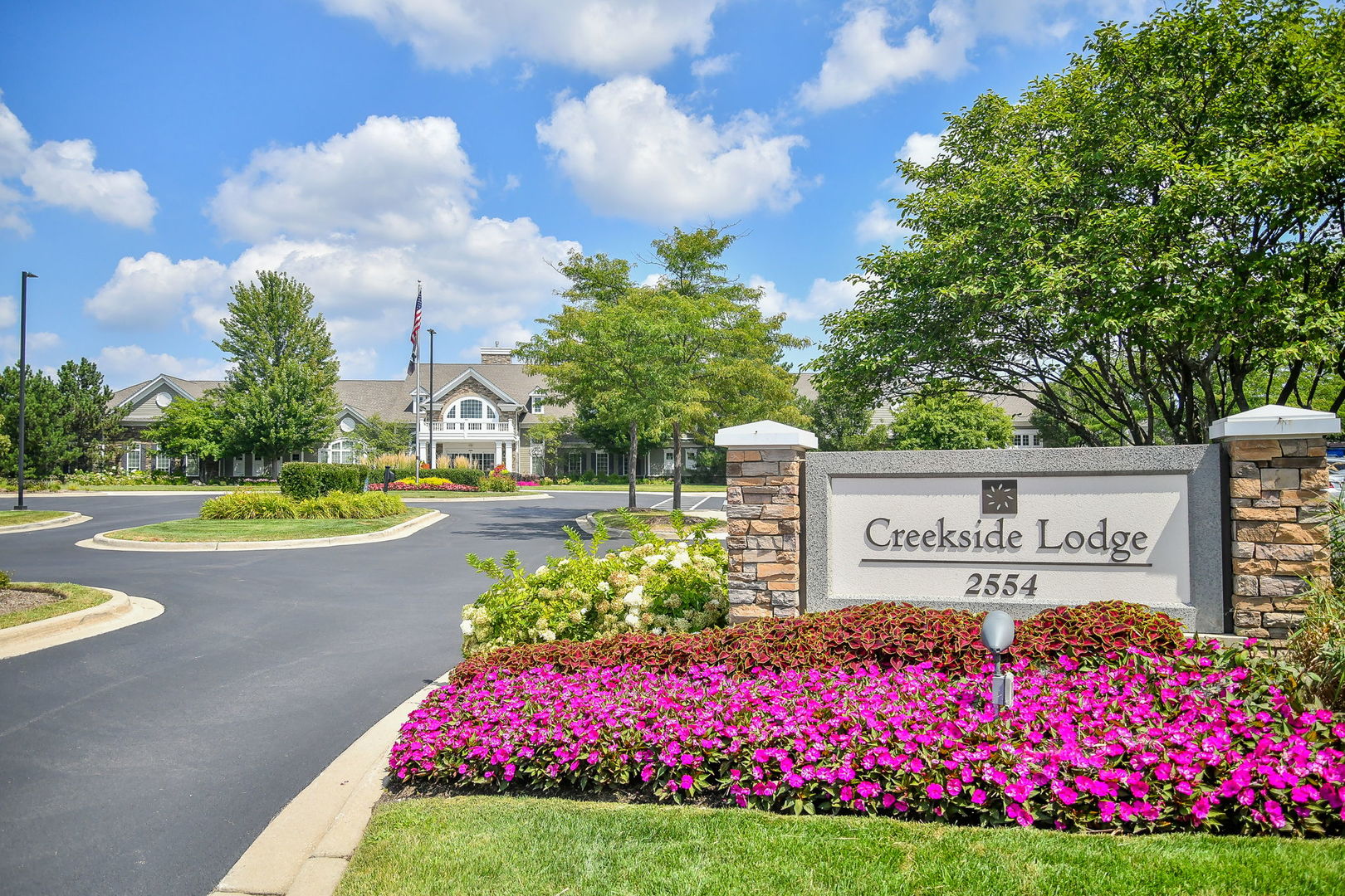 2525 Rolling Ridge Elgin, IL 60124 - Photo 20 of 26 a sign that is in front of flowers