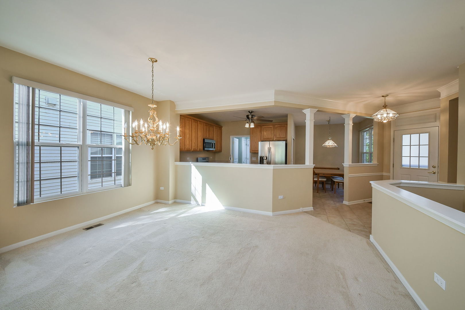 2525 Rolling Ridge Elgin, IL 60124 - Photo 2 of 26 a view of a big room with windows and chandelier