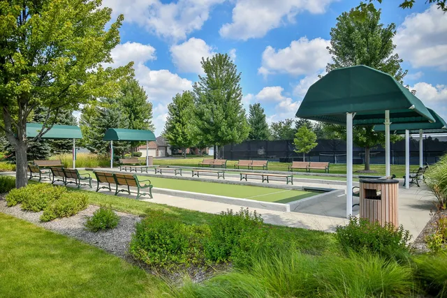 a view of a house with swimming pool and sitting area