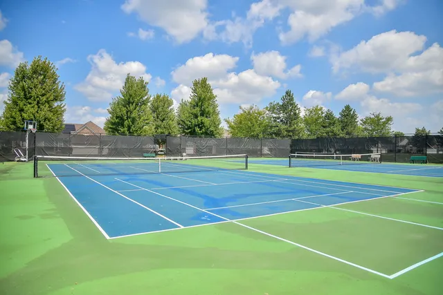 a view of an outdoor space and tennis court