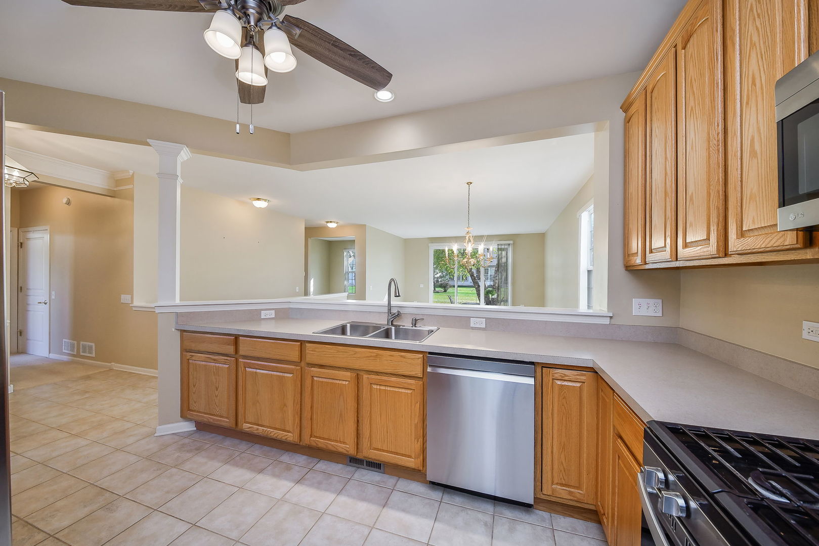 2525 Rolling Ridge Elgin, IL 60124 - Photo 7 of 26 a kitchen with a sink stove and cabinets