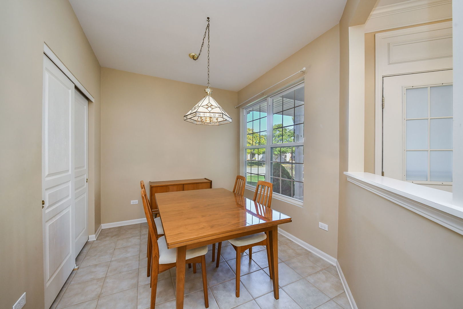 2525 Rolling Ridge Elgin, IL 60124 - Photo 8 of 26 a view of a dining room with furniture window and outside view