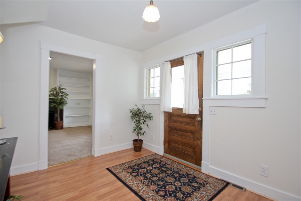 38 Virginia Street Springfield, MA 01108 - Photo 5 of 42 an entryway with a window and wooden floor