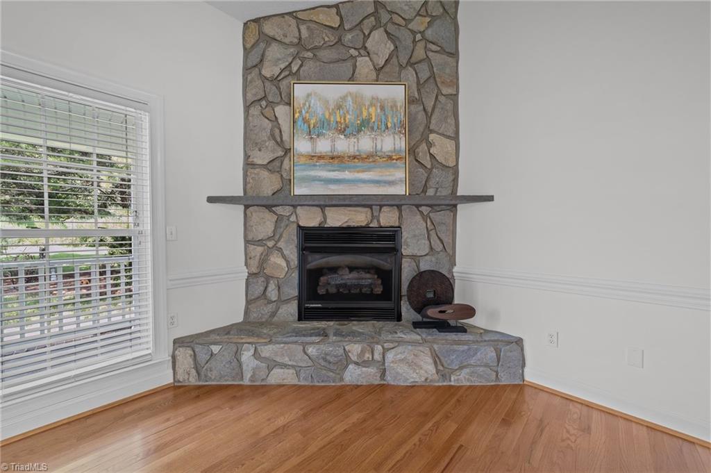 495 Ben Lee Road Thomasville, NC 27360 - Photo 8 of 35 Stone fireplace with gas logs