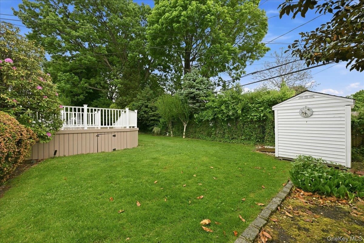 17 Avon Road Farmingdale, NY 11735 - Photo 38 of 46 a view of backyard with a garden and deck