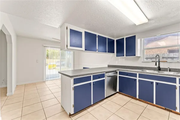 a kitchen with stainless steel appliances granite countertop a sink and cabinets