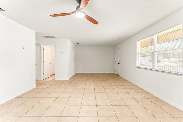 a view of an empty room with a window